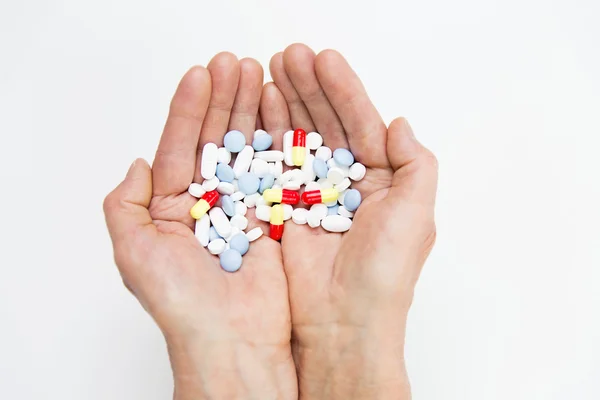 Close up of senior woman hands with pills — Stock Photo, Image
