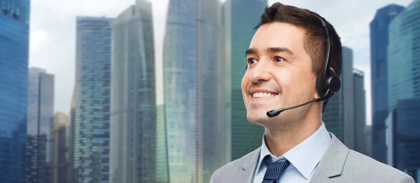 Happy businessman in headset — Stock Photo, Image