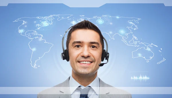 Smiling businessman in headset — Stock Photo, Image