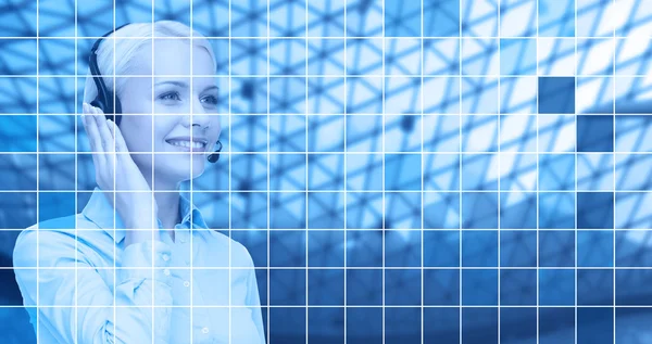 Helpline operator in headset over blue grid — Stock Photo, Image