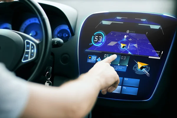 Male hand using navigation system on car dashboard — 스톡 사진