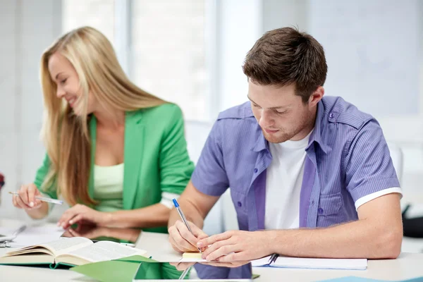 Group of happy high school students with textbooks — Stock Photo, Image