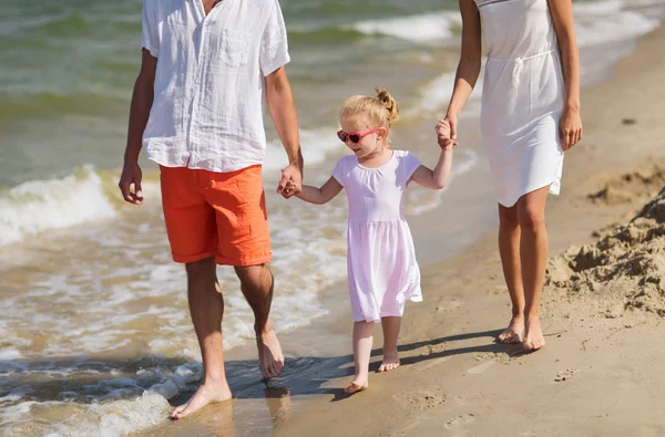 Happy family in sunglasses on summer beach — Stock Photo, Image