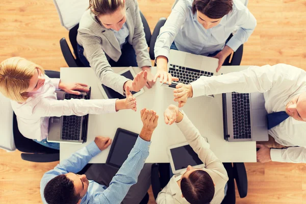 Close up of business team showing high five — Stock Photo, Image