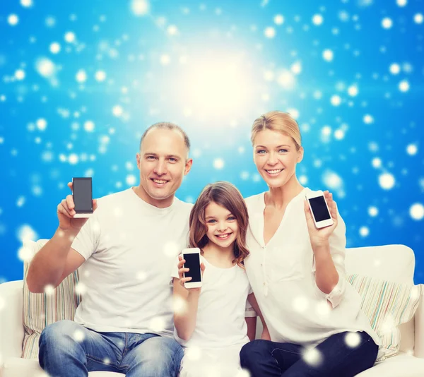 Happy family with smartphones — Stock Photo, Image