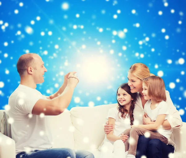 Happy family with camera at home — Stock Photo, Image