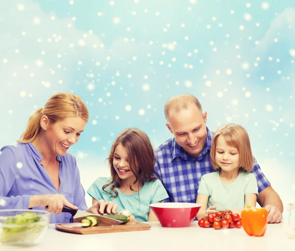 Happy family with two kids making dinner at home — Stock Photo, Image