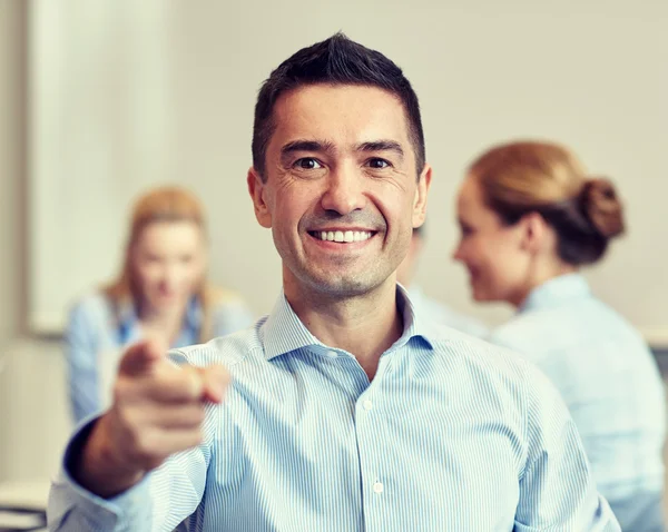 Group of smiling businesspeople meeting in office — Stock Photo, Image