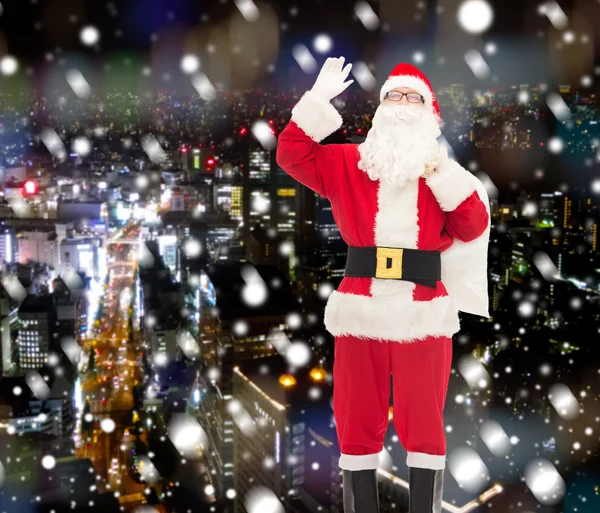 Man in costume of santa claus with bag — Stock Photo, Image