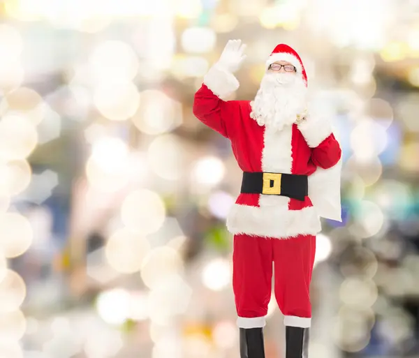 Homme en costume de Père Noël claus avec sac — Photo