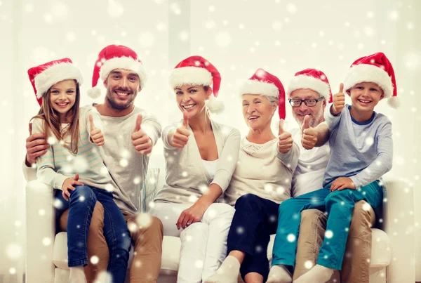 Happy family sitting on couch at home — Stock Photo, Image