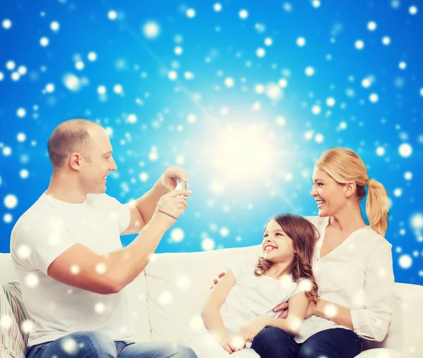 Happy family with camera at home — Stock Photo, Image