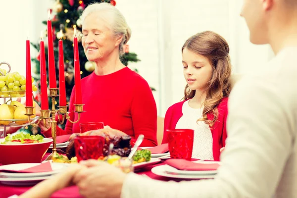 Smiling family having holiday dinner at home — Stock Photo, Image