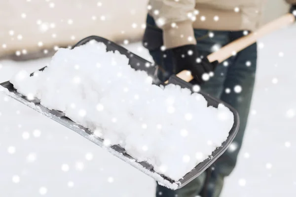 Closeup of man digging snow with shovel — Stock Photo, Image