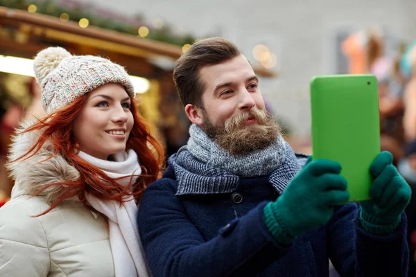 Couple taking selfie with tablet pc in old town — ストック写真