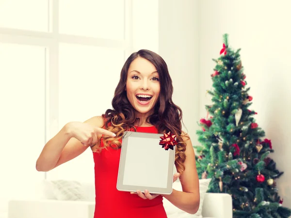 Smiling woman in red dress with tablet pc — Stock Photo, Image
