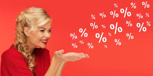 Woman with sale and percentage signs over red — Stock Photo, Image