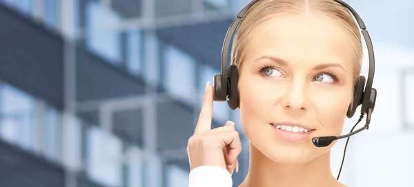 Helpline operator in headset over business center — Stock Photo, Image