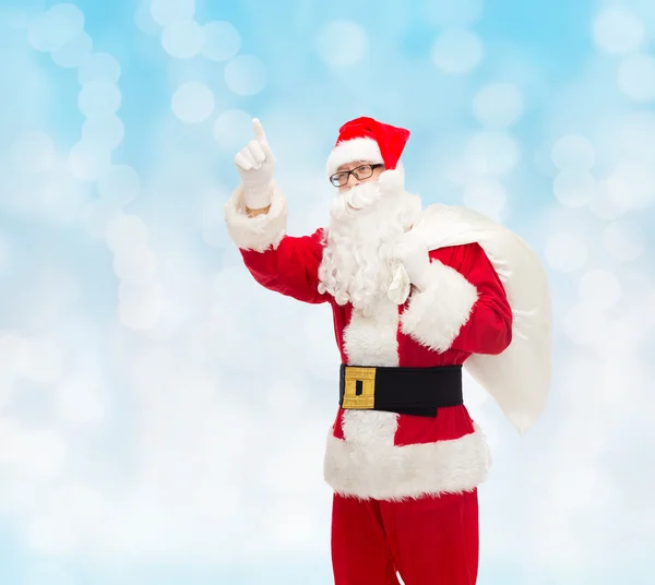 Man in costume of santa claus with bag — Stock Photo, Image