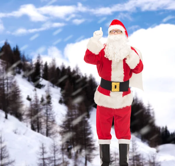 Homme en costume de Père Noël claus avec sac Images De Stock Libres De Droits