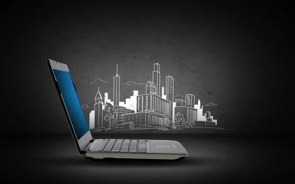 Laptop computer with blank screen and city sketch — Stockfoto