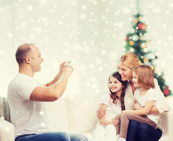 Happy family with camera at home — Stock Photo, Image