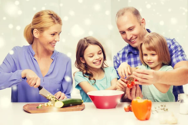 Happy family with two kids making dinner at home — Stock Photo, Image