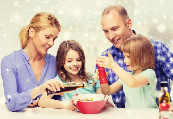 Happy family with two kids making salad at home — Stock Photo, Image