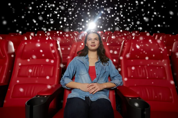 Young woman watching movie in theater — Stock Photo, Image