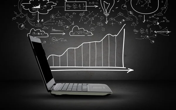 Öppna bärbar dator med programmet och diagram doodles — Stockfoto