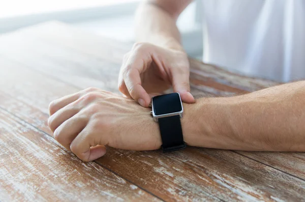 Close up of male hands setting smart watch — Stock Photo, Image