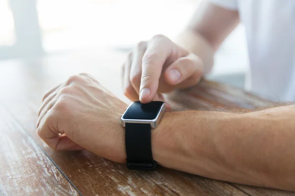 Close up of male hands setting smart watch — Stock Photo, Image