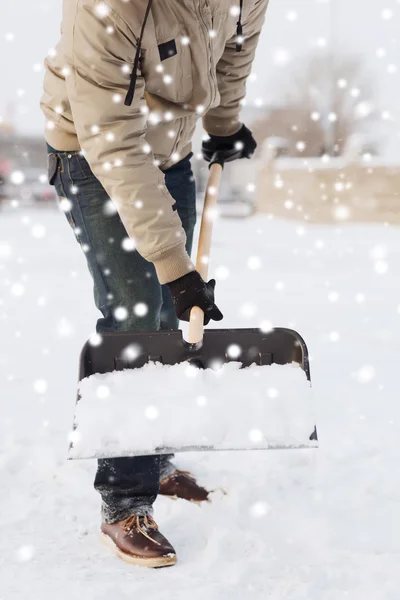 Closeup of man digging snow with shovel — Stock Photo, Image