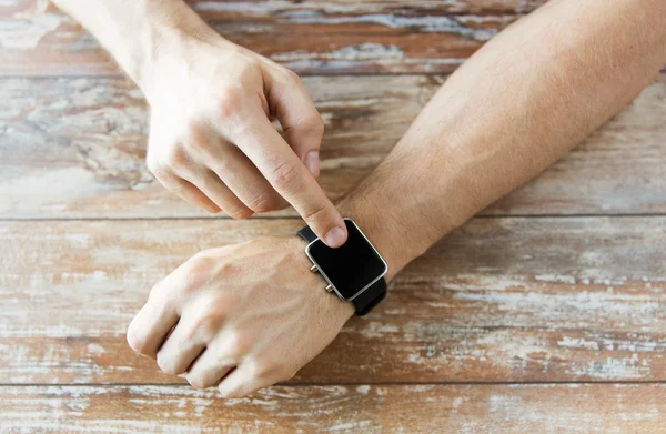 Close up of male hands setting smart watch — Stock Photo, Image