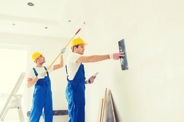 Group of builders with tools indoors — Stock Photo, Image