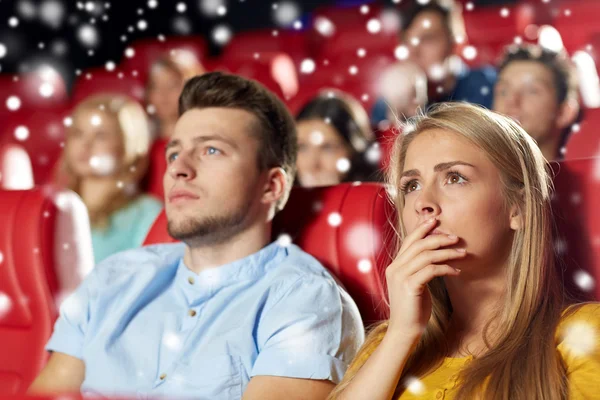 Friends or couple watching horror movie in theater Stock Kép