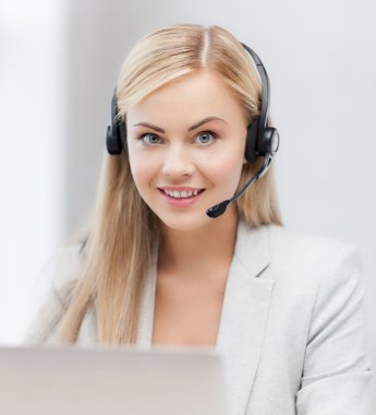 friendly female helpline operator with laptop clipart