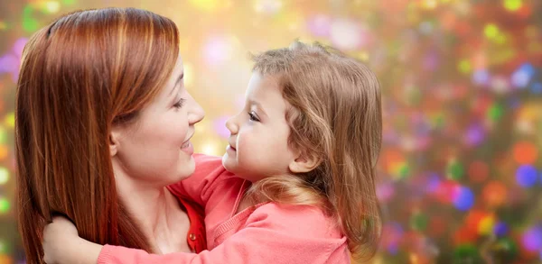 Happy mother and little daughter hugging — Stock Photo, Image