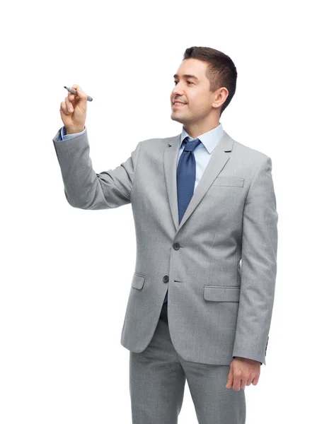 Feliz hombre de negocios en traje escribiendo algo — Foto de Stock