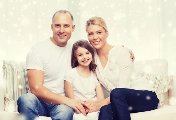 Smiling parents and little girl at home — Stock Photo, Image