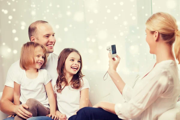 Happy family with camera taking picture at home — Stock Photo, Image