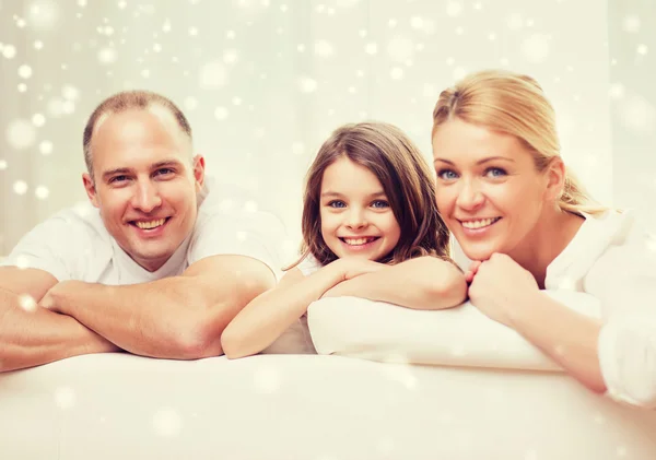 Smiling parents and little girl at home — Stock Photo, Image