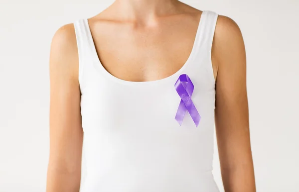 Close up of woman with purple awareness ribbon — 스톡 사진