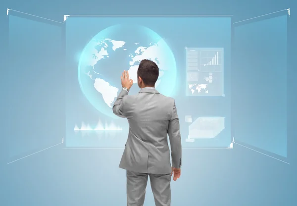Businessman touching virtual screen with globe — ストック写真