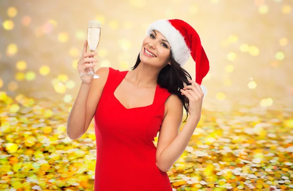 Mooie sexy vrouw in Kerstman hoed en rode jurk — Stockfoto