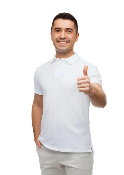 Sonriente hombre mostrando pulgares hacia arriba —  Fotos de Stock