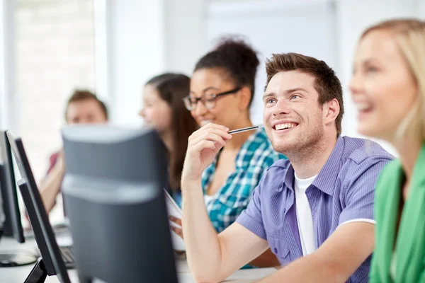 Happy high school students in computer class — Stock Photo, Image