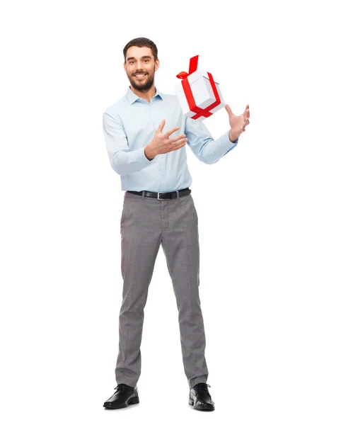 Happy young man playing with gift box — Φωτογραφία Αρχείου