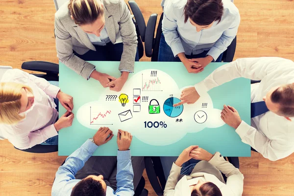 Close up of business team sitting at table — Stock Photo, Image