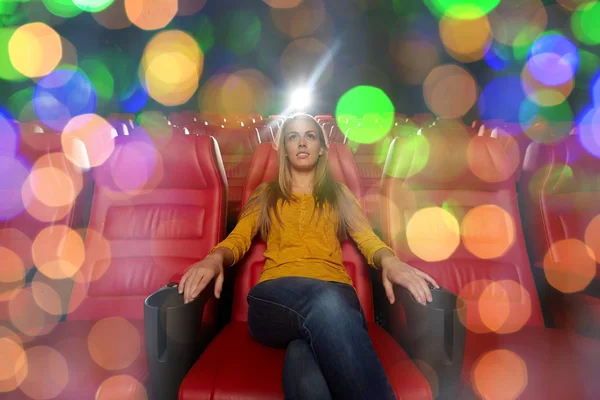 Young woman watching movie in theater — Stock Photo, Image